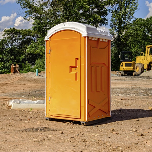 how often are the portable restrooms cleaned and serviced during a rental period in Delmita